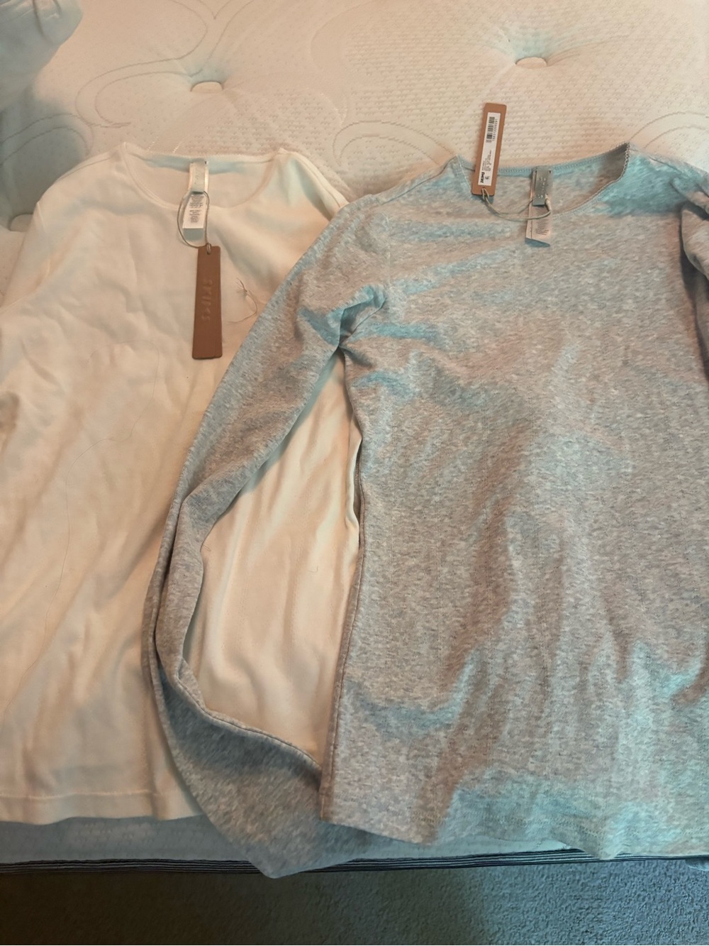 SKIMS Long Sleeve Scoop Neck Tops in Cream and Light Gray